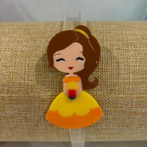 Girls headband with character design on side.